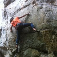 Ian Teh at the technical moves scaling the start of this granite climb