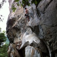 Jed gracefully dances up the crux slab section of Weasel's Penthouse